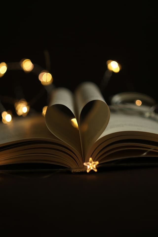 Open book with sparkles